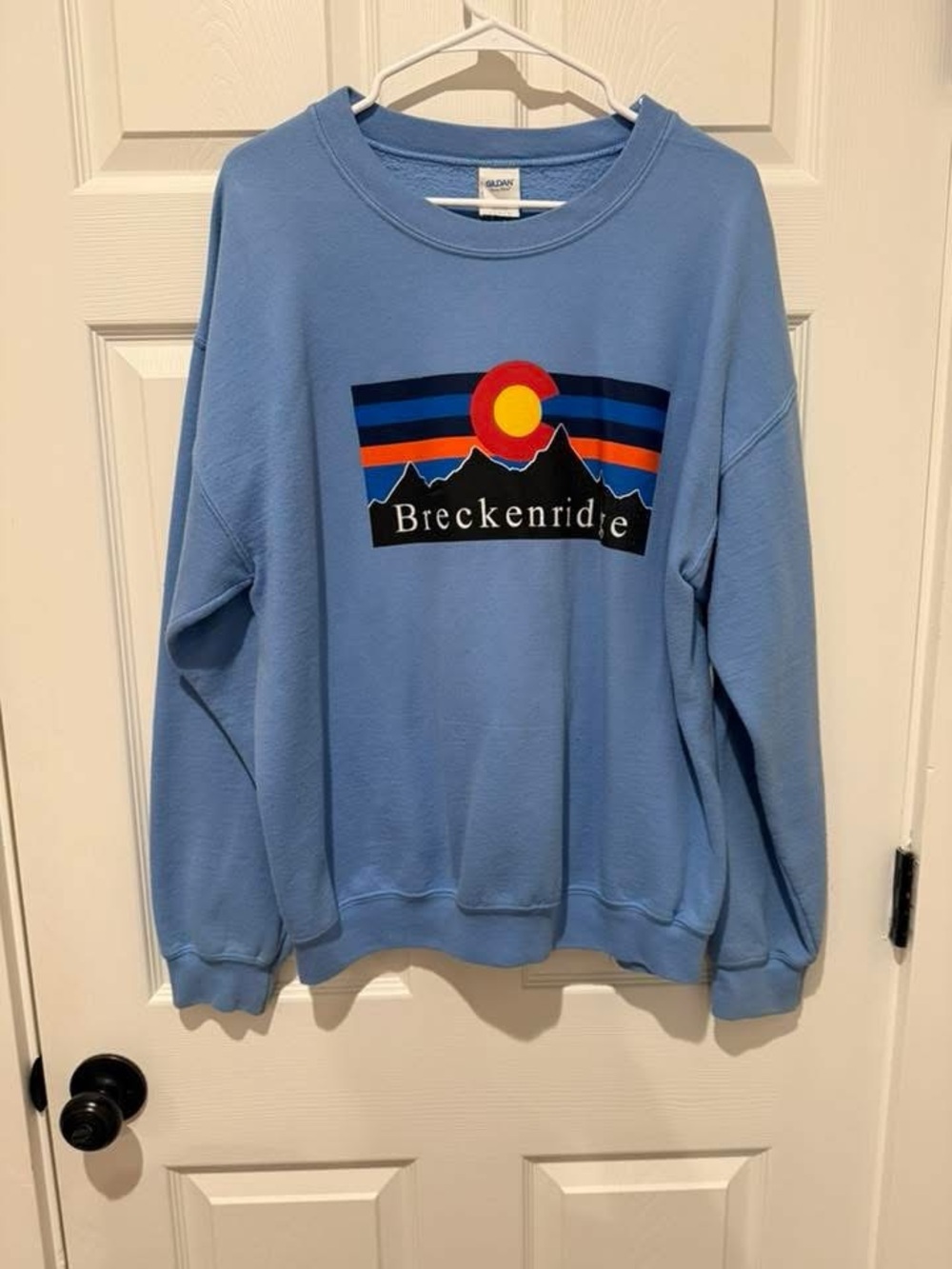 Breckenridge Light Blue Sweatshirt with Sunset Mountain Graphic